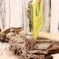 Preview: Handgefertigter Bookmarker von chic-peppig-bunt steckt in gelbem Buch.